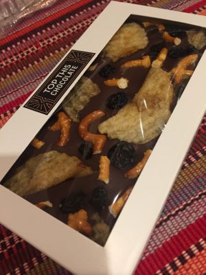 You can make your own chocolate bars! The dark chocolate is vegan and they clearly label all of the vegan toppings! This is dark choc with potato chips, pretzels, & blueberries. at Top This Chocolate in Ventura