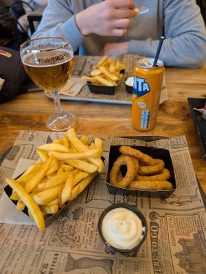 Medium fries, vegan mayo and onion rings. at FritBar in Bruges