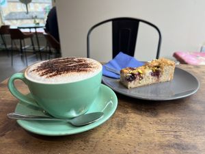 Oat cappuccino and cake   at The Chakra Lounge in Bakewell