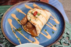 Naan wrap with vegan sausages and sweet and sour fruit chutney at The Chakra Lounge in Bakewell