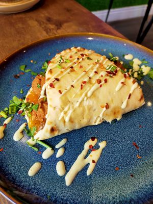 Naan Wrap with Vegan Sausages, chutney and spices  at The Chakra Lounge in Bakewell