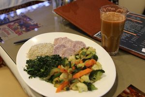 This meal has for example arrow roots, rice and mixed vegetables that had 6-7 different vegetables. Also is freshly made organic juice that had carrots, apple and spinach.  at Bridges Organic Health Restaurant in Nairobi