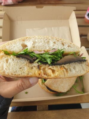 The Shroom: Grilled portobello mushroom, harissa aioli, pickled red onion, and rocket on toasted ciabatta roll at For Change in Middle Park