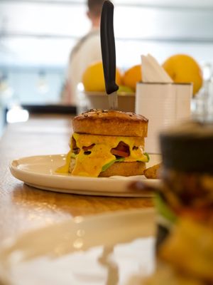 Double Cheese Burger. Homemade brioshe bun, special patty, fresh veggies and rustic potato wedges at We Cafe - Maybe closed in Cape Town