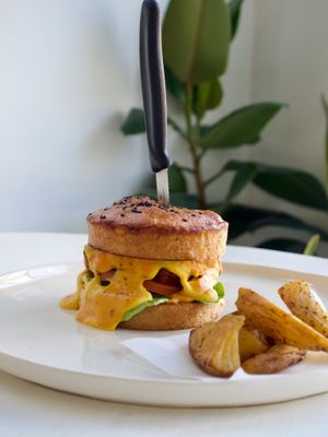 Double Cheese Burger. Homemade brioshe bun, special patty, fresh veggies and rustic potato wedges at We Cafe - Maybe closed in Cape Town
