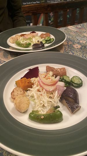 Steamed Vegetable plate consisting of tiny slices of each veg. Aubergine was nice but king oyster mushroom was completely raw  at Mominoki House in Tokyo