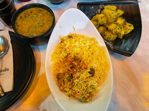 Daal palak, vegetable biryani, and Bombay aloo  at Mother India in Mellieha