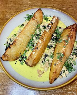 Fingerling potatoes with aji amarillo, cured olive, peanut, and cilantro  at Vedge in Philadelphia
