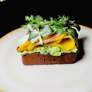 CHARRED GOLD BEETS with avocado, pumpernickel, cucumbers and dill  at Vedge in Philadelphia