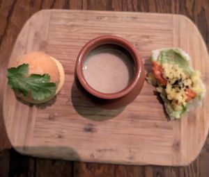 hominy fritter with aji amarillo, sunchoke bisque, and avocado chip with romesco & pickled cauliflower at Vedge in Philadelphia