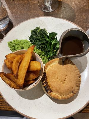 Vegan pot pie, smashed peas + chips   at The George in Hathersage