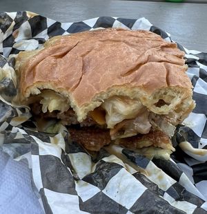 Paradise burger with big slice of grilled pineapple   at Tabay's Mindful Kitchen in Kahului