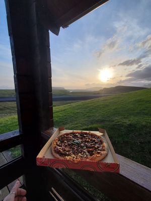 10/10 recommend dinner with a view! at Black Crust Pizzeria in Vik