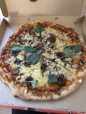 Vegan pizza without the substitute meat and sourdough crust   at Black Crust Pizzeria in Vik