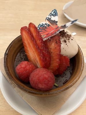 Vegan chocolate pot dessert with edible rice paper butterfly   at House O'Hill in Newton Stewart