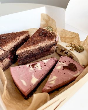 ✨ Vegan treasures: blackcurrant chocolate cake, raw cake Caramel Apple, raw cherry cashew cake with walnut chocolate base. at Gluten-free Bakery in Yerevan