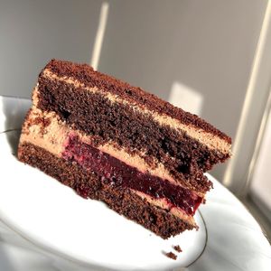 Chocolate cake: chocolate biscuits, chocolate cream, berry layer at Gluten-free Bakery in Yerevan