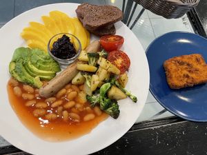 Vegan breakfast plate, 179 baht. I’d have never thought of having mango and baked beans on the same plate, but this was really good!  at Heaven Burger in Chiang Rai