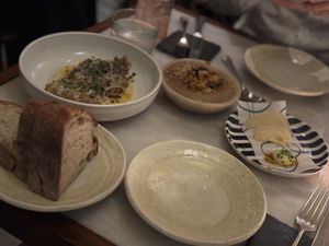 1. Aubergine.  Kalamatas.  Tahini.  2. Lentil parfait.  Chili garlic.  3.  Preserved “summer” fennel.  Aioli.  4. Coombeshead sourdough.  Sable.  at Tendril in London