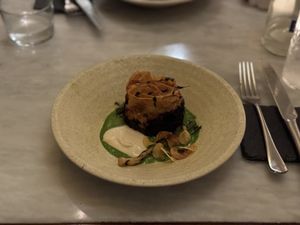 Grilled mushroom.  Smoked potato pie.  Butterbean.  Leek.  Chive emulsion.  at Tendril in London