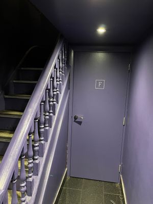 Labyrinthine lavender subterranean toilet tunnel at Tendril in London