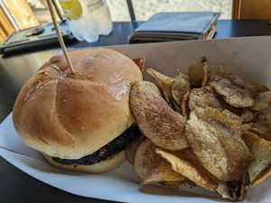 Veggie burger and chips. Burger had aioli, tomato, red onion, and arugula. at Beer Tree Brew in Port Crane