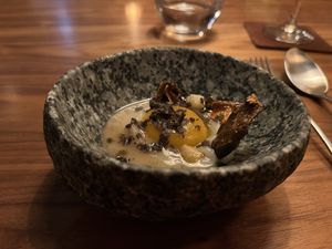 Vegan ‘egg’ — the yolk is spherified pumpkin purée  at Encanto in Lisbon