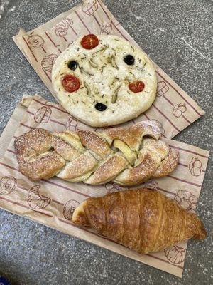 Focaccia, pastry with vanilla custard filling and croissant  at La Revuelta in Granada