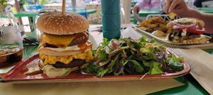 Mac and cheese burger w salad at Athens Vegan Burgers in Athens