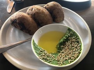 Stuffed bread starter with kale butter and sesame seeds.   at Folke in Vancouver