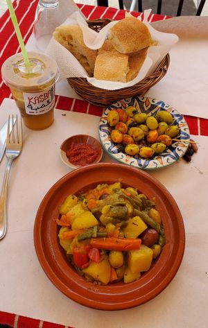 Apple juice, veggie tagine, olive plate and bread (offered for free) at Chez Hassan Bab Kasbah in Tangier