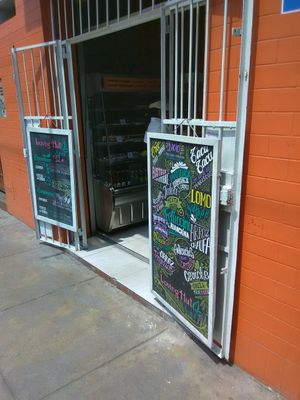 Entrance with menu boards at Loving Hut Lince in Lima