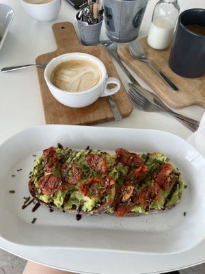 Avocado and sun-dried tomato’s on toast, and oat milk flat white   at Fika in Liverpool