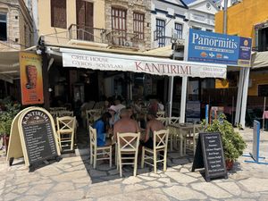 Outside - note available tables for 2 - refused to seat me   at Kantirimi Grill House in Symi
