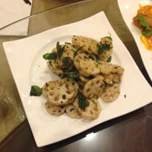 Lotus root with basil leaves at The Origin in Kuala Lumpur