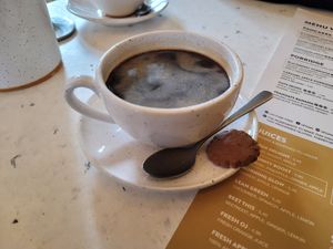 Vegan cookie with coffee at Oats Day Long in Leuven