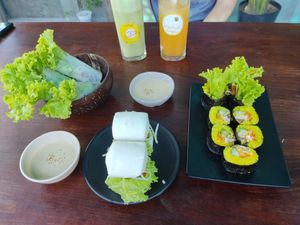 Bao Buns, Spring Rolls, Sushi, Guava Juice and Orange Juice. Dipping Sauce a Peanut Tahini at Chickpea Eatery Thuan Chay in Hoi An
