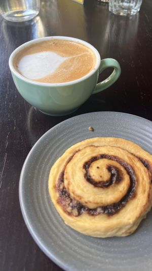 Cappuccino and cinnamon roll  at Chickpea Eatery Thuan Chay in Hoi An