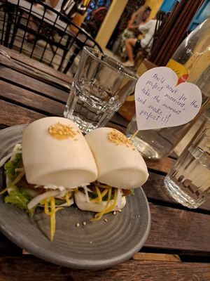 Delicious bao bun starter with a positive message at Chickpea Eatery Thuan Chay in Hoi An