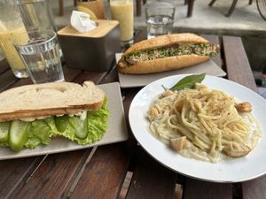 Cheese sandwich, Alfredo pasta, and tempeh banh mi sandwich! So delicious!  at Chickpea Eatery Thuan Chay in Hoi An