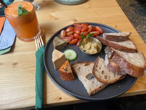 Vegan cheese plate with roasted bread and fig mustard and freshly pressed juice at drei&zwanzig in Karlsruhe