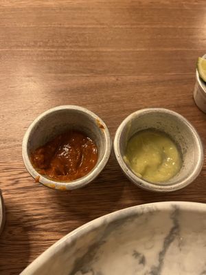 Chipotle sauce and jalapeño sauce  at La Santa Guadalupe - Centro Histórico in Cartagena