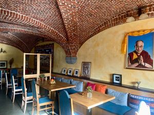 His Holiness the Dalai Lama keeps an eye on us.  at Tibetan Convention Tea House in Florennes