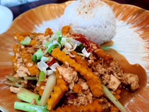 Pumpkin and tofu stir fry with coconut rice at Plants of Roselyn in South East London