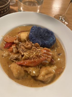 Massaman curry with butterfly pea sticky rice   at Plants of Roselyn in South East London