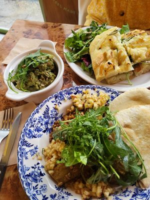 The eggplant, focaccia sandwich, and the pesto potatoes  at Rooted 루티드 in Seoul