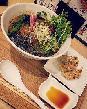 Black sesame ramen with gyoza at T's Tantan - Tokyo JR Station in Tokyo