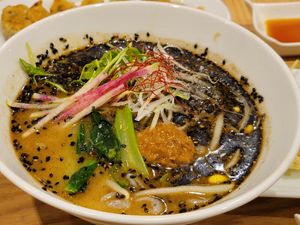 Black sesame ramen with special starch noodles added at T's Tantan - Tokyo JR Station in Tokyo