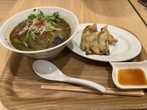 Black sesame ramen with gyoza  at T's Tantan - Tokyo JR Station in Tokyo