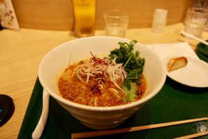 really nice food! This was the golden sesame option, and a remaining dumpling lurking in the corner at T's Tantan - Tokyo JR Station in Tokyo
